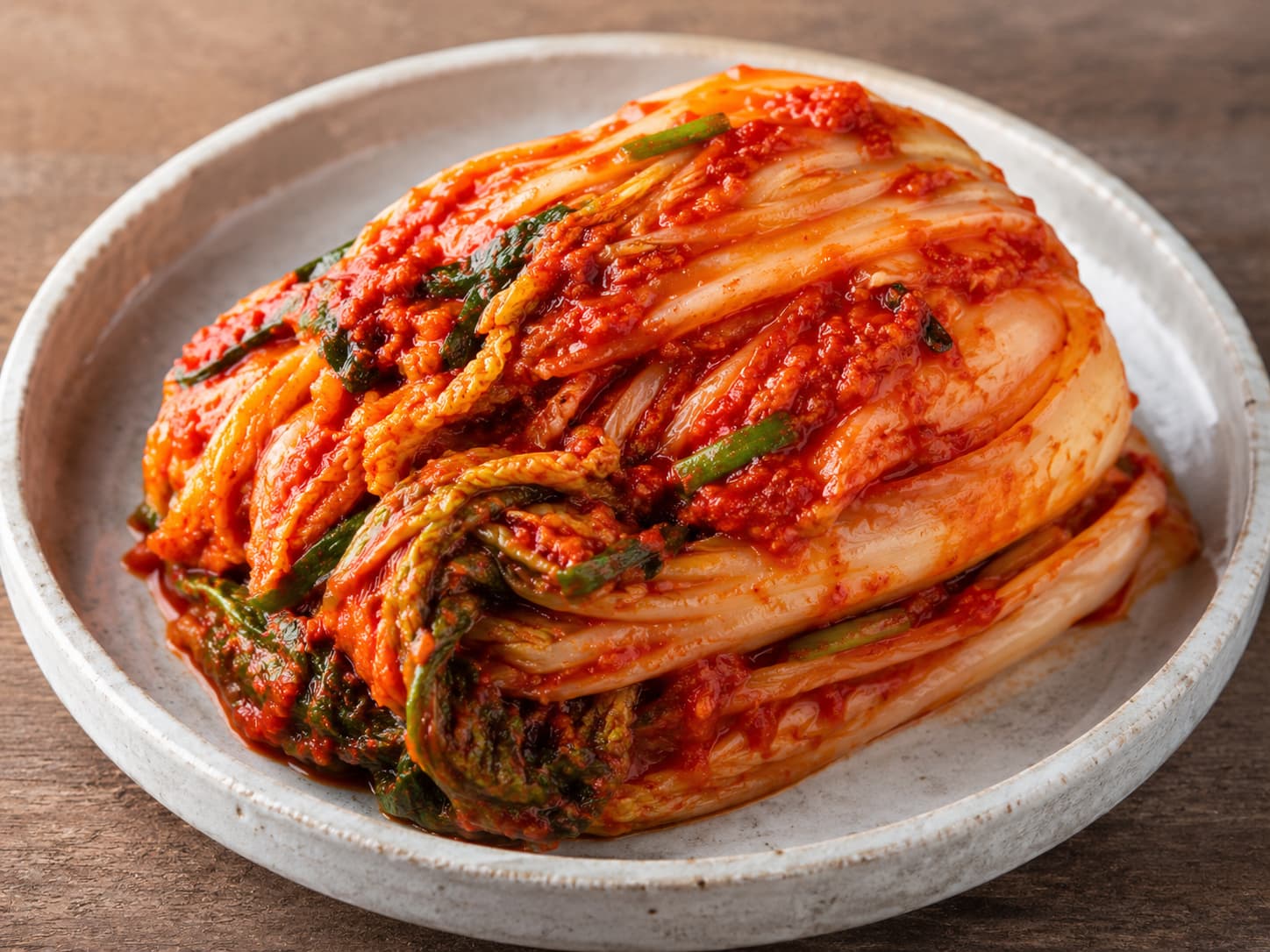 Bowl of traditional Korean baechu-kimchi made with whole napa cabbage